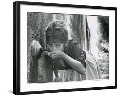Actress Sophia Loren Drinking Water from Spigot During the Filming of Madame Sans Gene - Black Framed Art Print Wall Art, 24x18