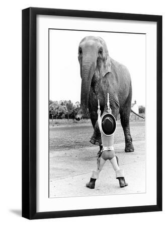 Child Disguised as a Cowboy Playing with Elephant, England, Great Britain, 1976 (Photo) - Black Framed Art Print Wall Art, 12x18 Child Disguised as a Cowboy Playing with Elephant, England, Great Britain, 1976 (Photo) - Black Framed Art Print Wall Art, 12x18