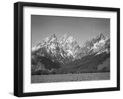 Grassy Valley Tree Covered Mt Side And Snow Covered Peaks Grand "Teton NP" Wyoming 1933-1942 - Black Framed Art Print Wall Art, 16x12